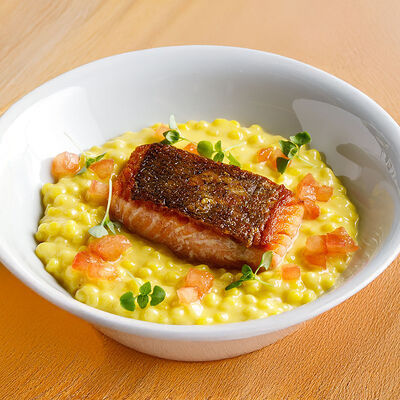 Стейк из форели с птитимом и томатами в La Biga по цене 1490 ₽