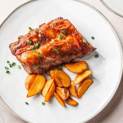 Свиные рёбра с картофельными дольками в BEERMAN&Schlitz по цене 970 ₽