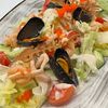 Фирменный салат из морепродуктов в Острова по цене 890