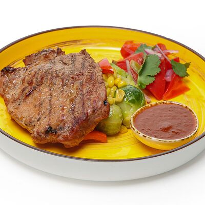 Стейк из свиной шеи в Chillis Bar по цене 690 ₽