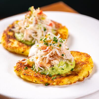 Драники с камчатским крабом и кремом из авокадо в Just Residence по цене 2390 ₽