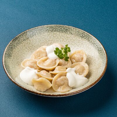 Пельмени с курицей отварные в Мираж по цене 230 ₽