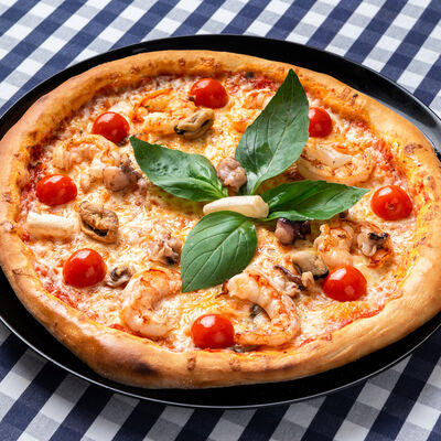 Пицца Морская в Trattoria Caffe Del Sole по цене 570 ₽