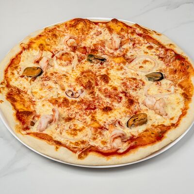 Пицца с морепродуктами в Date по цене 1450 ₽
