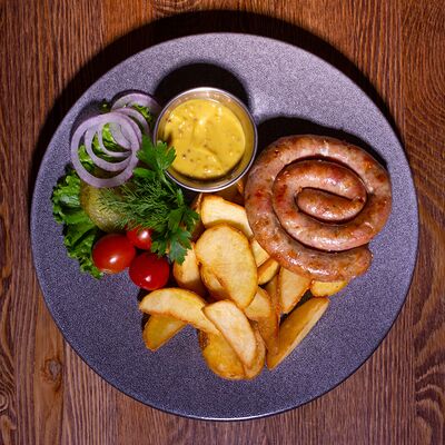 Колбаска Кезеркрайнер в Кнедлик по цене 595 ₽