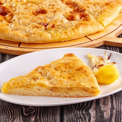 Пирог с картофелем и пассерованым луком в Осетинские Пироги по цене 1100 ₽