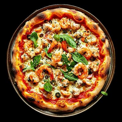 Пицца с морепродуктами в Вкуснопарк по цене 1240 ₽