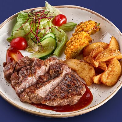 Стейк из свиной шеи с картофельными дольками в соусе Бурбон в Конор по цене 970 ₽