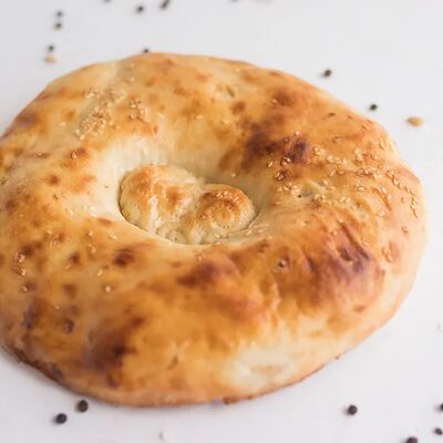 Тандырная лепешка в Регистан Шаурма по цене 50 ₽