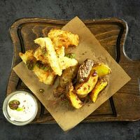 Треска в кляре с печеным картофелем в Остерия Il Massimo