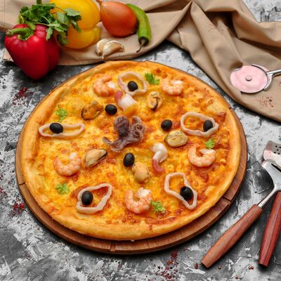 Пицца с морепродуктами в Вкусное место по цене 530 ₽