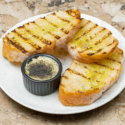 Хлеб с копченым маслом в Чизерия Восточный по цене 200 ₽