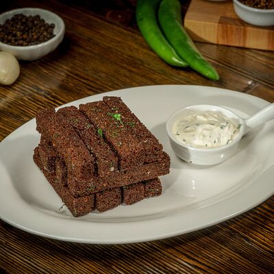 Гренки чесночные в Пловная по цене 170 ₽