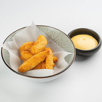 Детские куриные наггетсы с сырным соусом в Южанин по цене 64000 сум