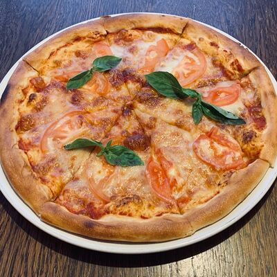 Пицца Маргарита в Помидорро по цене 545 ₽