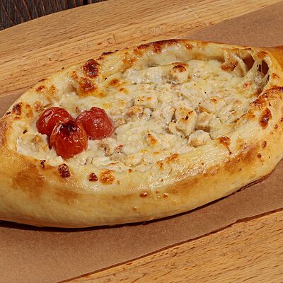 Хачапури по-аджарски с шкмерули в У Ханумы по цене 580 ₽