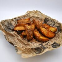 Картофельные дольки с пармезаном и паприкой в Кафе Сербской кухни Шеff