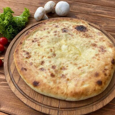 Осетинский пирог картофель с грибами в Farina Pizza по цене 650 ₽