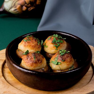 Шампиньоны с сыром сулугуни в Пиросмани по цене 590 ₽