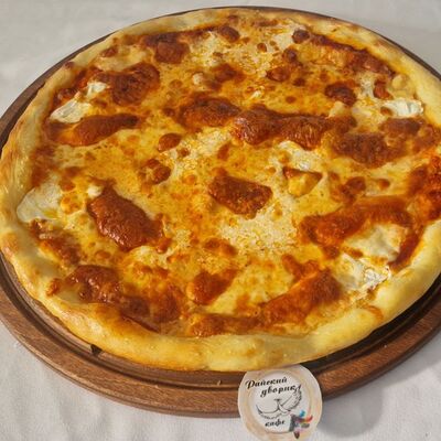 Пицца 4 сыра в Райский дворик по цене 1100 ₽