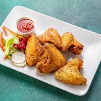 Хрустящие куриные крылышки в Ресторан Бигджо