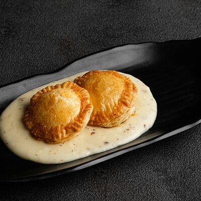 Пирожки с курицей и пармезаном в Де'рибас по цене 485 ₽