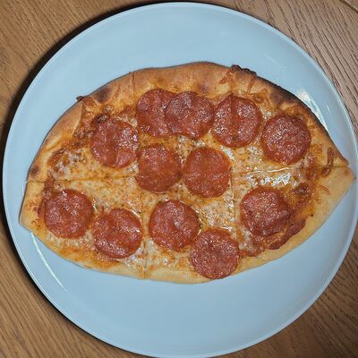 Мини-пицца Пеперони в Романовская пекарня по цене 610 ₽