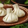 Вареные хинкали с курицей и сулугунив Аджика по цене 468