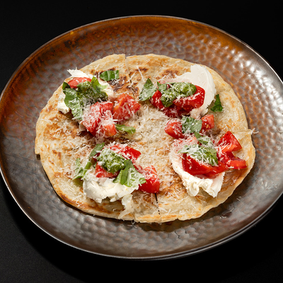 Лепешка с томатами и творожным сыром в Culture по цене 580 ₽