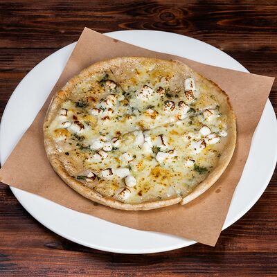 Лепешка с брынзой и зеленью в Трактир Колесо по цене 313 ₽