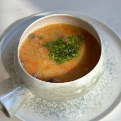 Гороховый суп с копченым брискетом в Prana по цене 750 ₽