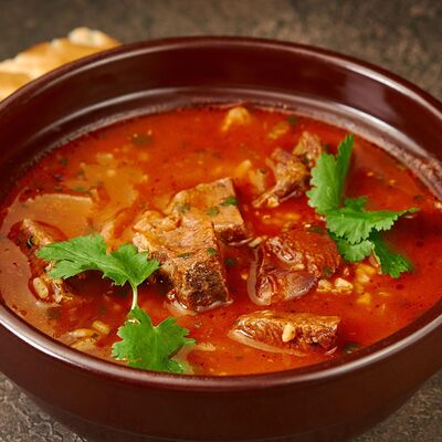 Харчо с курицей, ткемали и грецким орехом в Айран по цене 249 ₽