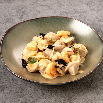 Рыбные пельмени в соусе том ям в Сибирская Корона по цене 679 ₽