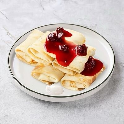 Большая порция блинчиков с творогом и вишневым вареньем в Шоколадница по цене 943 ₽