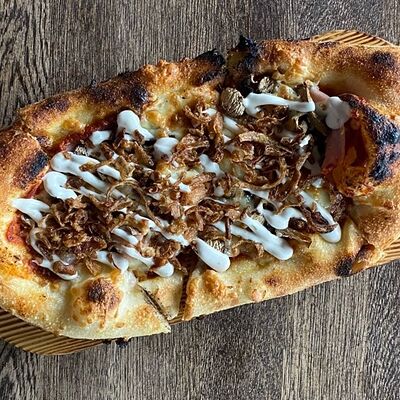 Пиццета Шампиньоны-ветчина-колбаски в Бекки бар по цене 430 ₽