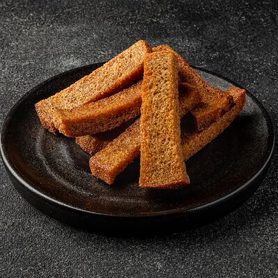 Гренки с чесноком и сливочным соусом в Роллофф по цене 238 ₽