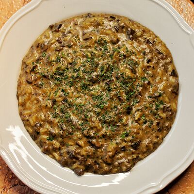 Ризотто с белыми грибамив TiAMA по цене 1250 ₽