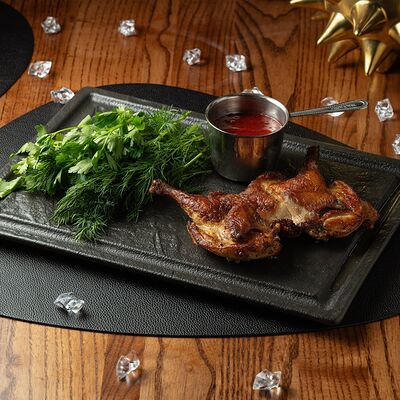 Цыпленок табака с соусом Ткемали в Giorgio Suluguni по цене 1220 ₽