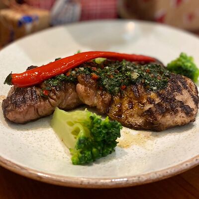 Стейк из свинины с соусом чимичурри в Ранчо Grill & Bar по цене 820 ₽