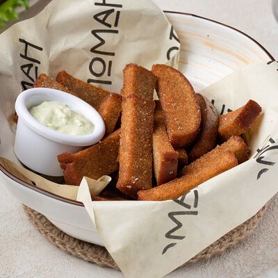 Гренки с сырным и чесночным соусом в Коломан по цене 350 ₽