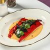 Запечённые перцы рамиро с голубцом из трав и кокосовым соусомв Grand 1873 Cafe по цене 890