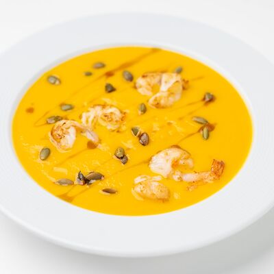 Крем-суп из тыквы с креветками в Волконский по цене 665 ₽