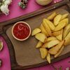 Картофель по-деревенски в Chillis Bar по цене 220