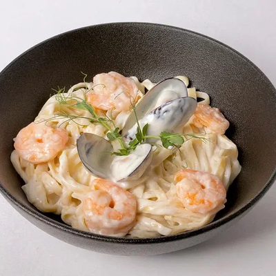 Паста с креветками в сливочно-чесночном соусе в Мидийный дом по цене 708 ₽