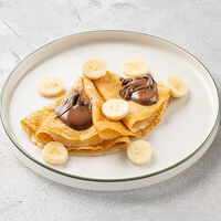 Блинчики с бананом и пастой Nutella в Шоколадница