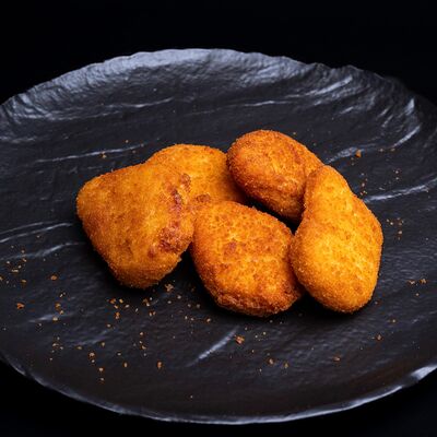 Куриные наггетсы в Amigoos по цене 340 ₽