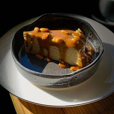 Блинный торт с кокосом и матчей в Picasso по цене 600 ₽