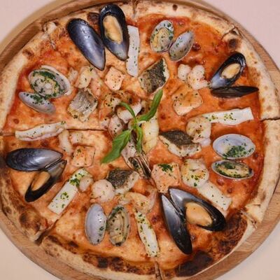 Пицца с морепродуктами в Positano по цене 2990 ₽
