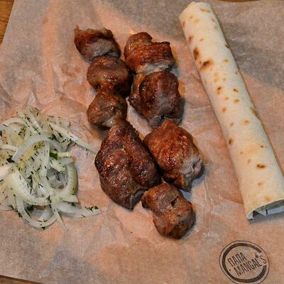 Шашлык из фермерской cвинoй шейки в Папа Mangals по цене 650 ₽