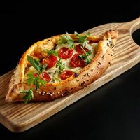 Балтийская лепешка с страчателлой и вялеными томатами в Про печь